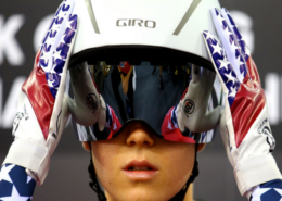 Image of Olympic Snowboarder adjusting her helmet