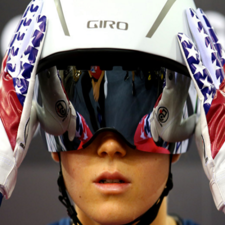 Image of Olympic Snowboarder adjusting her helmet