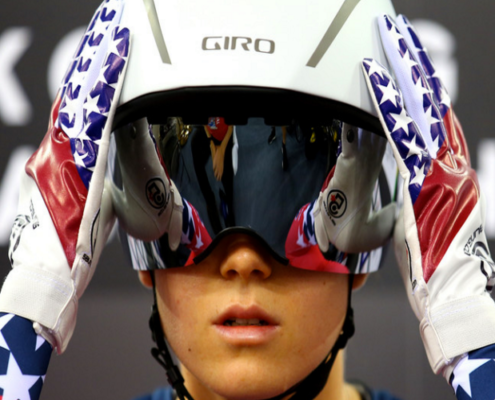 Image of Olympic Snowboarder adjusting her helmet