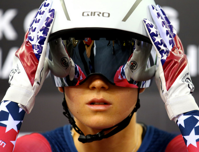 Image of Olympic Snowboarder adjusting her helmet