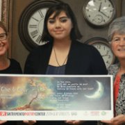 Maribella Smith with her winning poem, her teacher, and Jody Graf