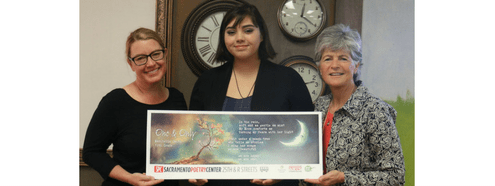 Maribella Smith with her winning poem, her teacher, and Jody Graf