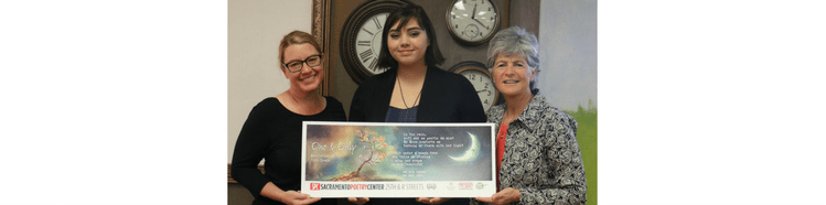 Maribella Smith with her winning poem, her teacher, and Jody Graf