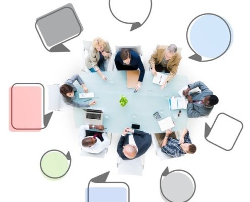 Group of Business People Meeting with Speech Bubbles