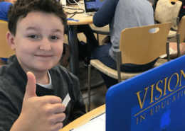 Visions student, Xavier P, giving a thumbs up