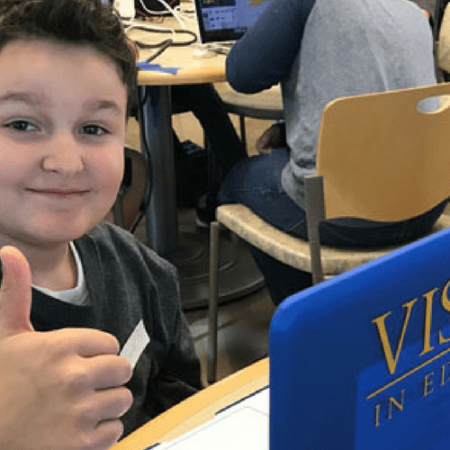 Visions student, Xavier P, giving a thumbs up