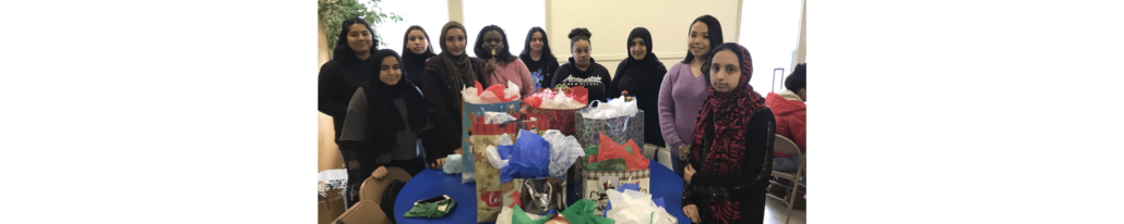Photos of students with wrapped presents for charity
