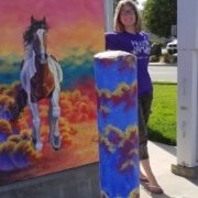 Photo of Emma S. with her painted utilities box in Brentwood