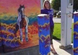 Photo of Emma S. with her painted utilities box in Brentwood