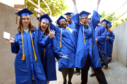 Cheerful graduates of Visions In Education