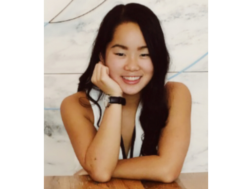 Female student posing and smiling for the camera