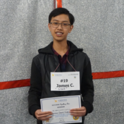 Male student smiles at the camera after winning the spelling bee