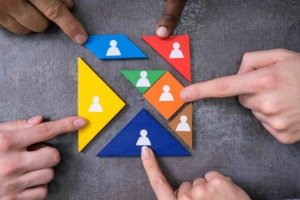 Person's Hands Completing Tangram Puzzle