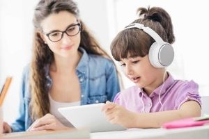 Mother and child watching videos together