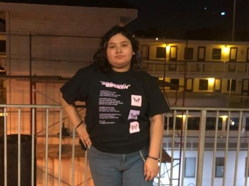 Female online high school student posing by the river for student spotlight article