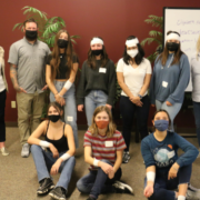 Students participated in activities including mock-bandaging and CPR chest compressions on dummies under the supervision of trained CPR professionals