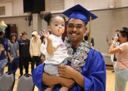 High school graduate celebrates at summer graduation after catching up on credits