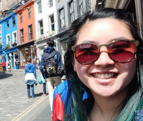 High school graduate smiles while studying abroad