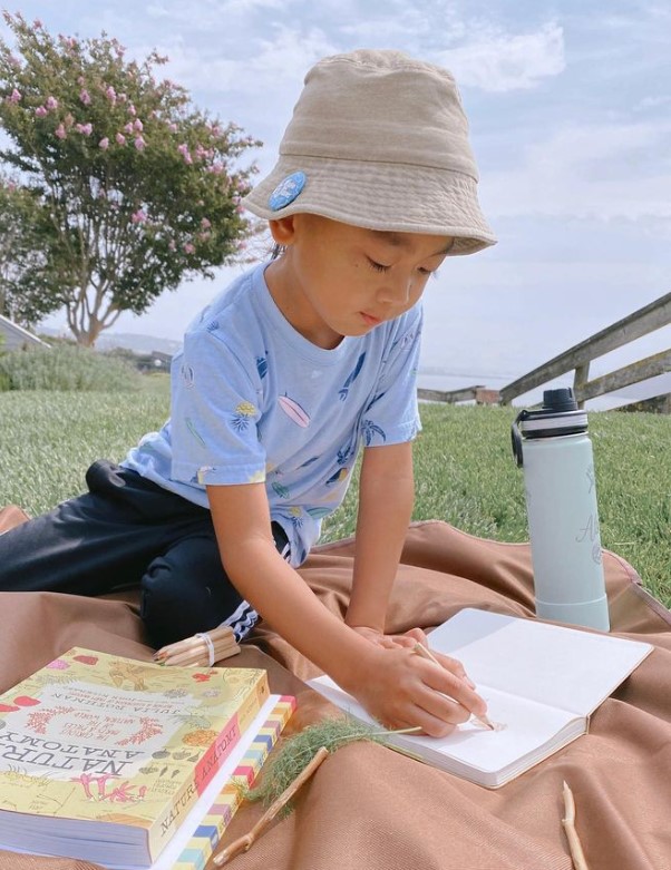 Home school student studies in the park