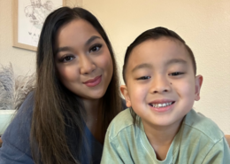 Smiling parent educator and her home school student read a book