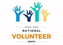 Multicolored hands raised with text that reads "April 2023 - National Volunteer Month"