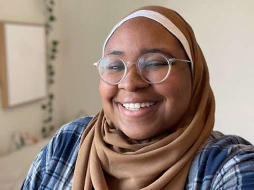 smiling online high school student who loves science