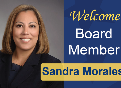 New board member Sandra smiles at the camera, graphic includes text "welcome board member Sandra Morales"