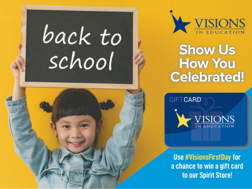 Young girl smiles and holds up a chalkboard sign that says "Back to School" on it