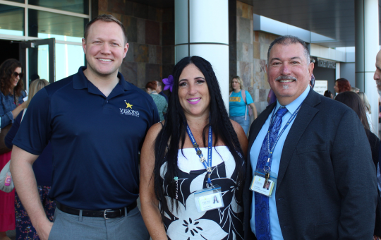 Group photo of Alumni Hall of Fame Inductee Tanner Zumwalt, his former Visions teacher, and Superintendent Steve Olmos.