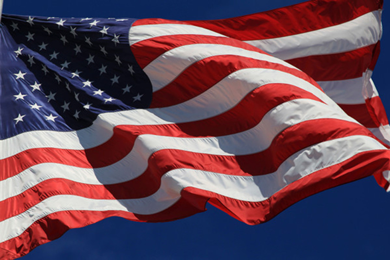 American flag blowing in the wind.