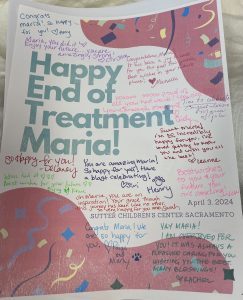Card filled with signatures that says "Happy End of Treatment Maria!"