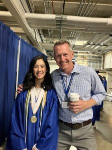 Visions graduate with former teacher.