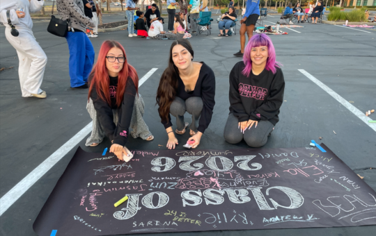 Visions seniors gathered to sign their class of 2026 banner