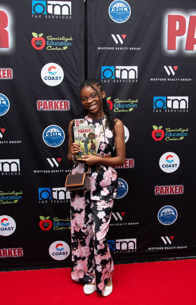 One of Visions' former students, Mackenzie Lee-Foster, celebrating Parker.