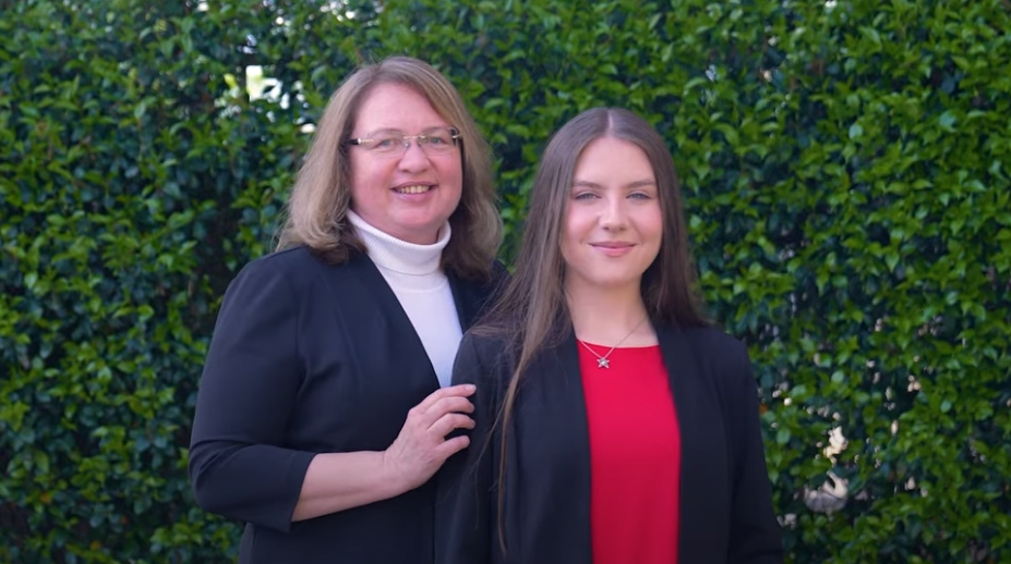 Mother and daughter smiling together
