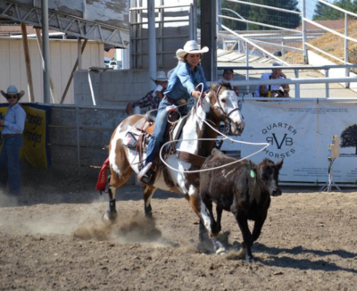 Jackie M. on her horse while participating in competition