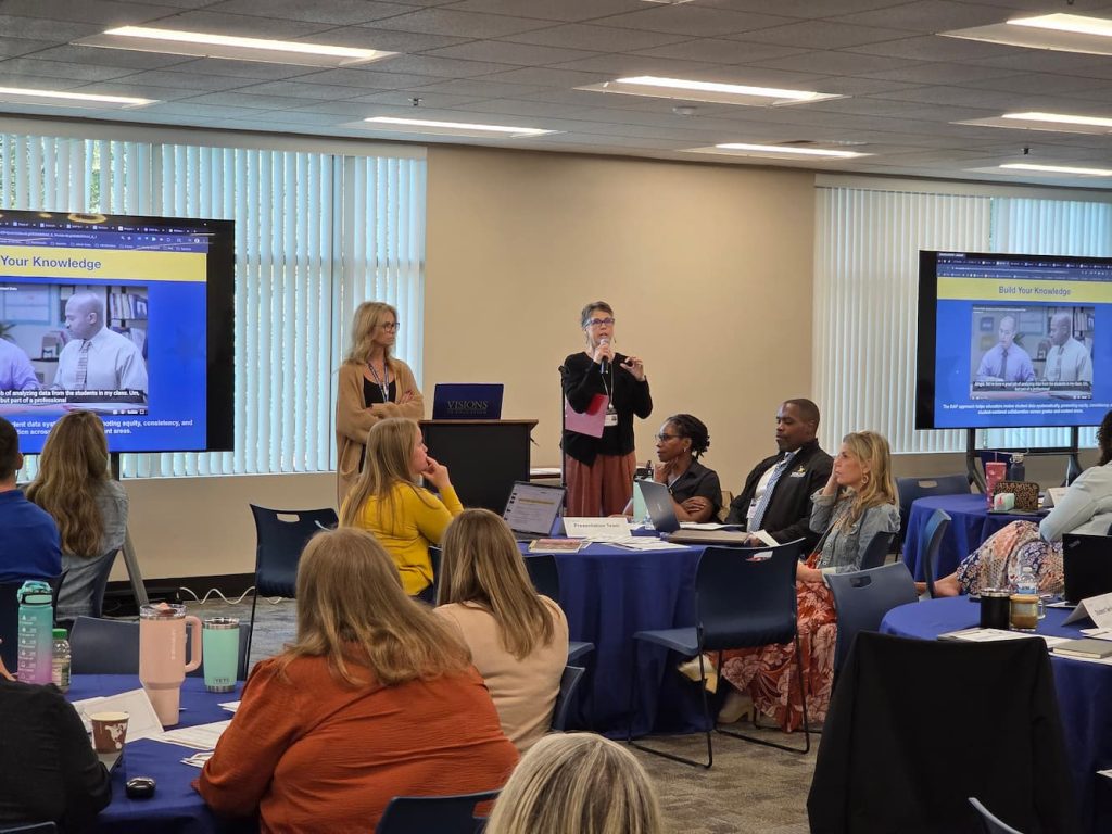 Visions staff presenting at a training