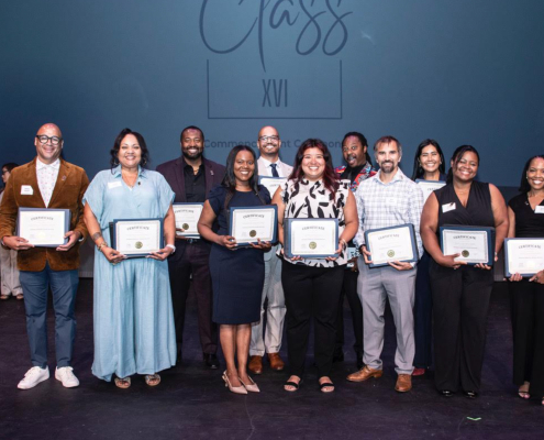 Matt Patterson stands with his leadership cohort and proudly poses for a group picture with his program graduate certificate.