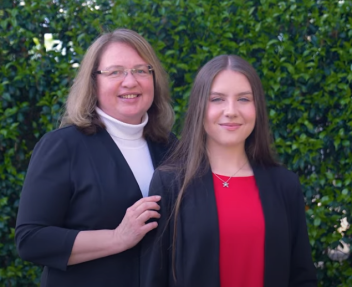 Mother and daughter smiling together