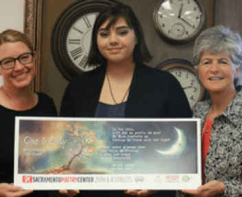 Maribella Smith with her winning poem, her teacher, and Jody Graf