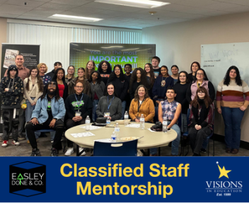 The group of student mentees and staff mentors gather together for a group picture.