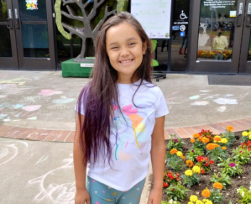 kai'lea poses in front of art for her student spotlight photo